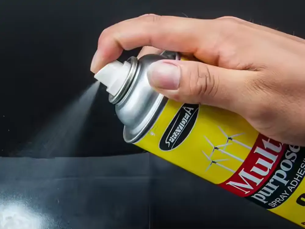 A visual montage demonstrating the use of Sprayidea 95 Multi-Purpose Adhesive for various crafting tasks, including adhering cutouts and ensuring precise placement for multi-layer projects.