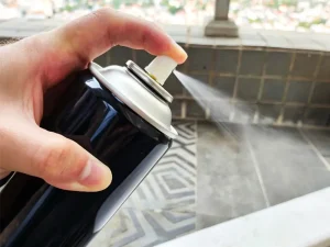 Applying spray adhesive from an aerosol can for quality testing